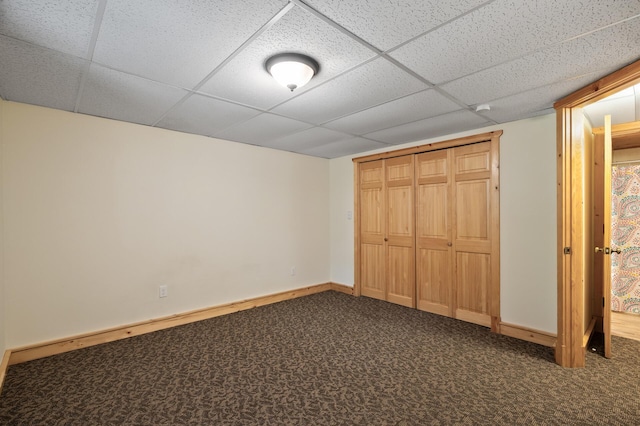 21750 Elk Lake Rd NW, Elk River, MN 55330 - unfurnished bedroom with a drop ceiling, carpet floors, a closet, and baseboards