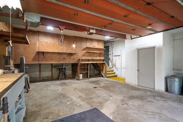 21750 Elk Lake Rd NW, Elk River, MN 55330 - garage featuring a workshop area and a garage door opener