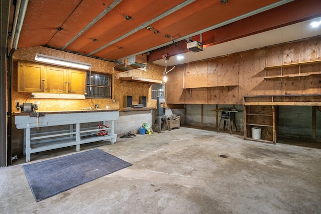 21750 Elk Lake Rd NW, Elk River, MN 55330 - garage with a workshop area and a garage door opener