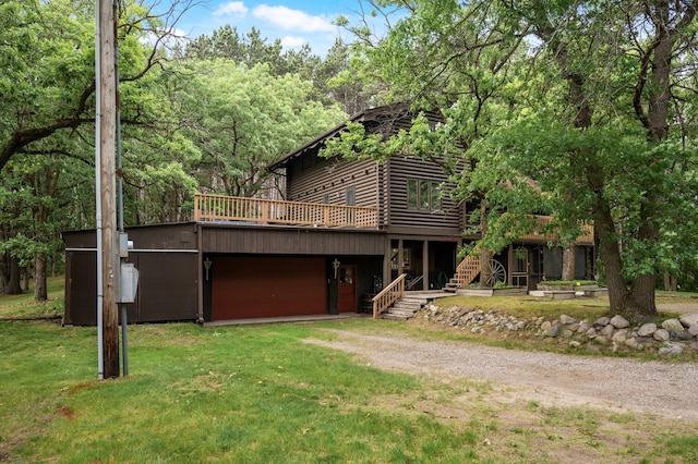 21750 Elk Lake Rd NW, Elk River, MN 55330 - view of front of house with driveway, log siding, stairway, a deck, and a front lawn