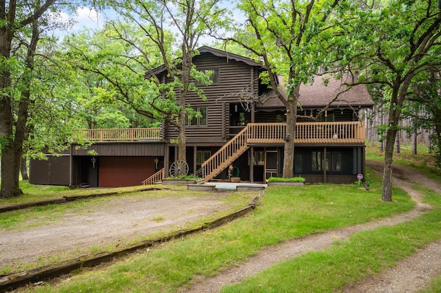 21750 Elk Lake Rd NW, Elk River, MN 55330 - rear view of property featuring dirt driveway, stairs, log exterior, a deck, and a lawn