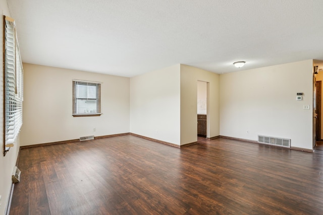 7007 Portland Ave, Richfield, MN 55423 - spare room with wood finished floors and baseboards