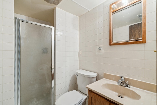 7007 Portland Ave, Richfield, MN 55423 - bathroom with tile walls, toilet, a stall shower, and vanity