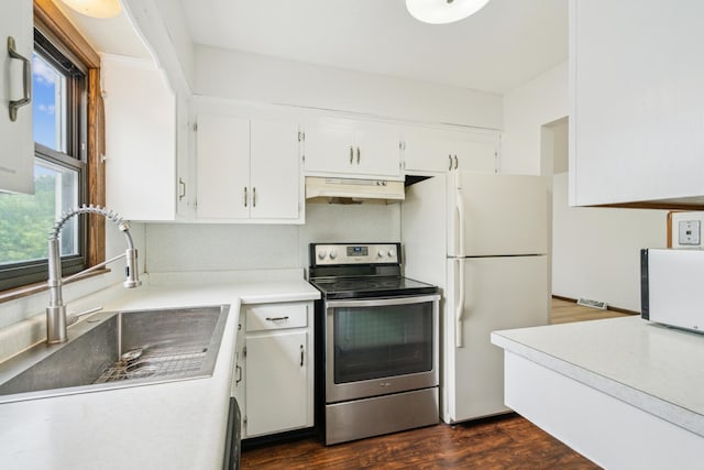 7007 Portland Ave, Richfield, MN 55423 - kitchen featuring electric range, under cabinet range hood, a sink, white cabinets, and light countertops