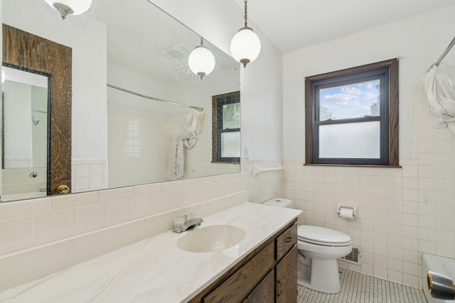 7007 Portland Ave, Richfield, MN 55423 - bathroom with toilet, vanity, tile walls, tile patterned flooring, and a shower with curtain
