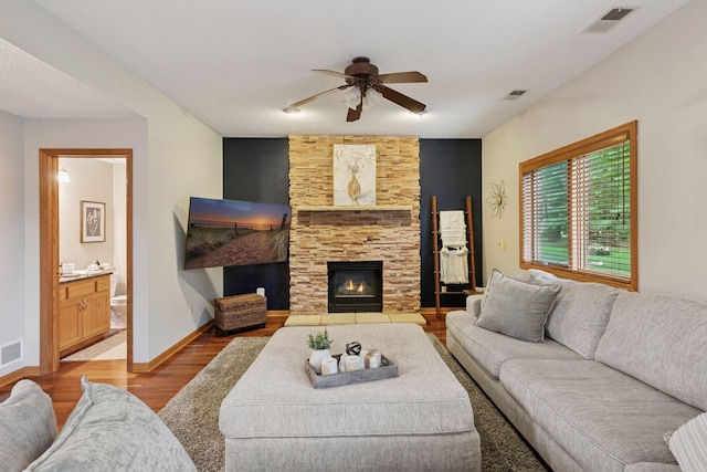 989 Coneflower Ct, Eagan, MN 55123 - living area featuring wood finished floors, a ceiling fan, and a fireplace