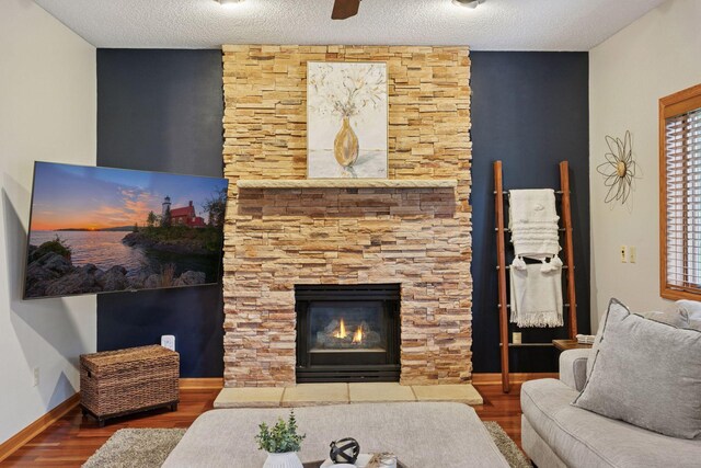 989 Coneflower Ct, Eagan, MN 55123 - living room featuring wood finished floors, a fireplace, and a textured ceiling