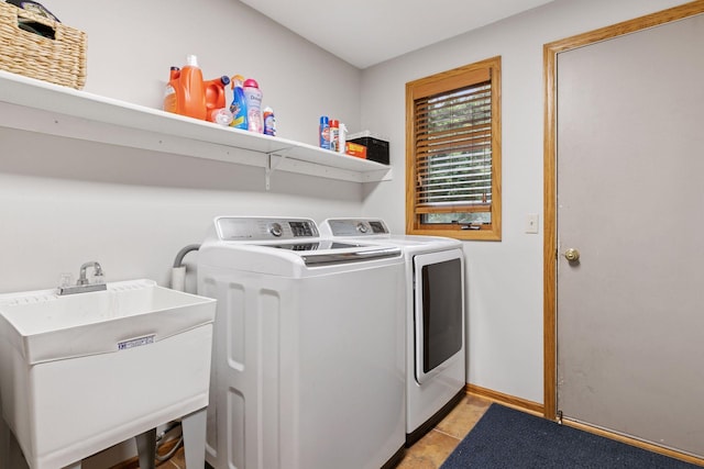 989 Coneflower Ct, Eagan, MN 55123 - laundry area featuring washer and clothes dryer and light tile patterned floors
