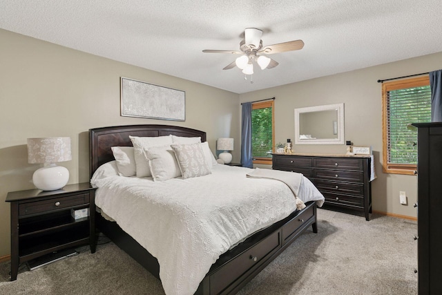 989 Coneflower Ct, Eagan, MN 55123 - bedroom with light carpet, ceiling fan, and a textured ceiling