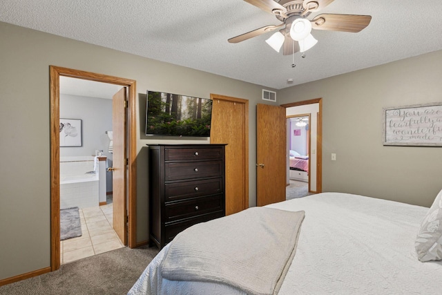 989 Coneflower Ct, Eagan, MN 55123 - bedroom with light colored carpet, ensuite bath, a textured ceiling, a ceiling fan, and light tile patterned flooring