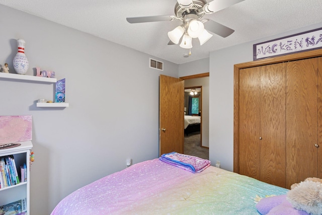 989 Coneflower Ct, Eagan, MN 55123 - bedroom featuring a closet, a ceiling fan, and carpet flooring