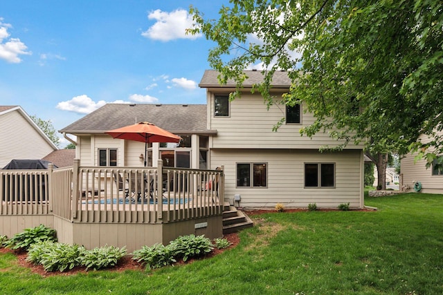 989 Coneflower Ct, Eagan, MN 55123 - back of house with a wooden deck, a yard, and a shingled roof