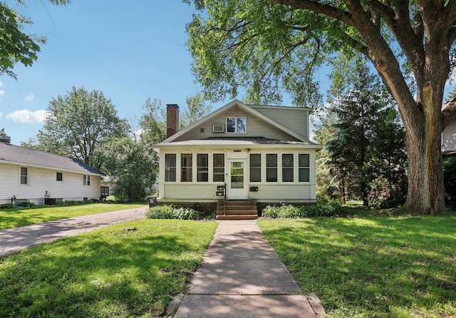 1384 Midway Pkwy, Saint Paul, MN 55108 - view of front of house with a chimney, entry steps, and a front yard