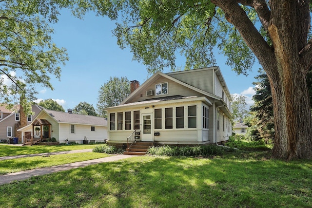 1384 Midway Pkwy, Saint Paul, MN 55108 - view of front of house featuring a chimney, a front yard, and entry steps