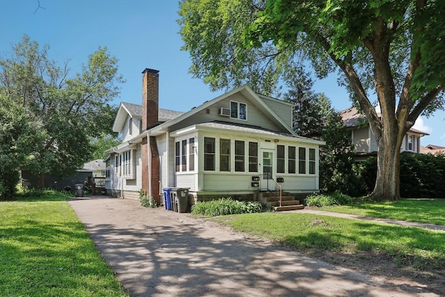 1384 Midway Pkwy, Saint Paul, MN 55108 - view of front of property featuring a chimney, entry steps, and a front lawn