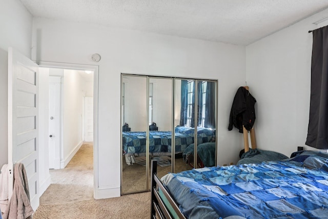 1384 Midway Pkwy, Saint Paul, MN 55108 - bedroom featuring light carpet, a closet, and a textured ceiling
