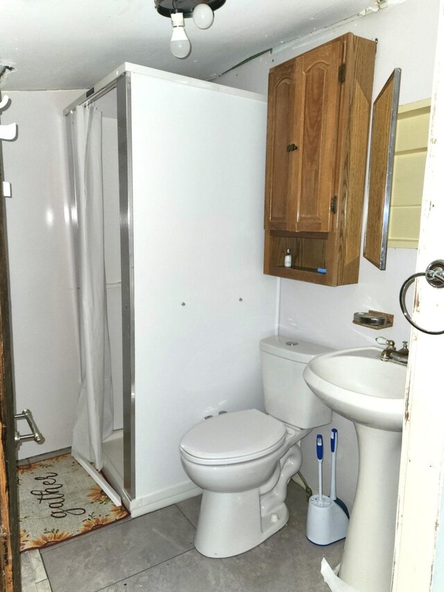 14 4th Ave SE, Dodge Center, MN 55927 - full bath with unfinished concrete flooring, a shower with shower curtain, and toilet