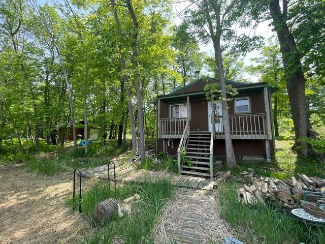 4716 Big Rice Lake Rd NE, Thunder Lake Twp, MN 56672 - view of front of property with stairs and covered porch