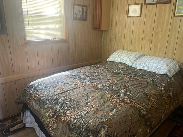 4716 Big Rice Lake Rd NE, Thunder Lake Twp, MN 56672 - bedroom with wood walls