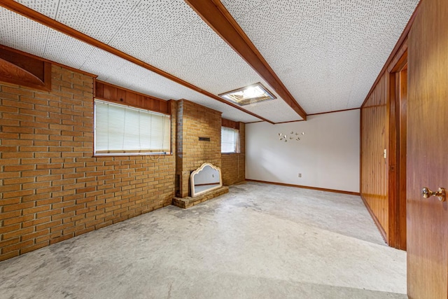 1819 4th Ave, Mankato, MN 56001 - carpeted empty room featuring brick wall