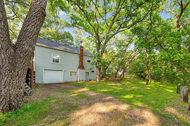 1819 4th Ave, Mankato, MN 56001 - view of yard featuring a garage and driveway