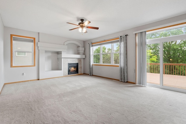 6701 Urbandale Ln N, Maple Grove, MN 55311 - unfurnished living room featuring a ceiling fan, carpet, and a tiled fireplace