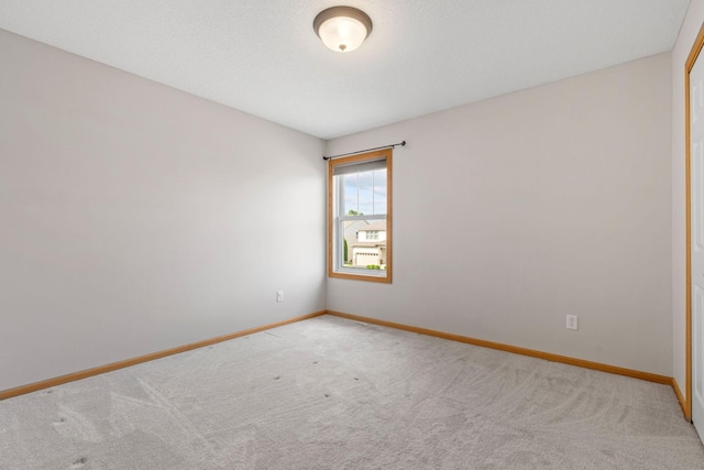 6701 Urbandale Ln N, Maple Grove, MN 55311 - carpeted empty room featuring baseboards