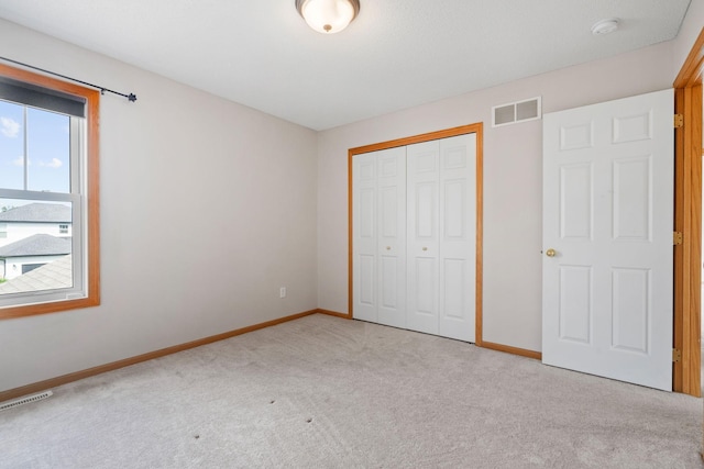 6701 Urbandale Ln N, Maple Grove, MN 55311 - unfurnished bedroom featuring carpet and a closet