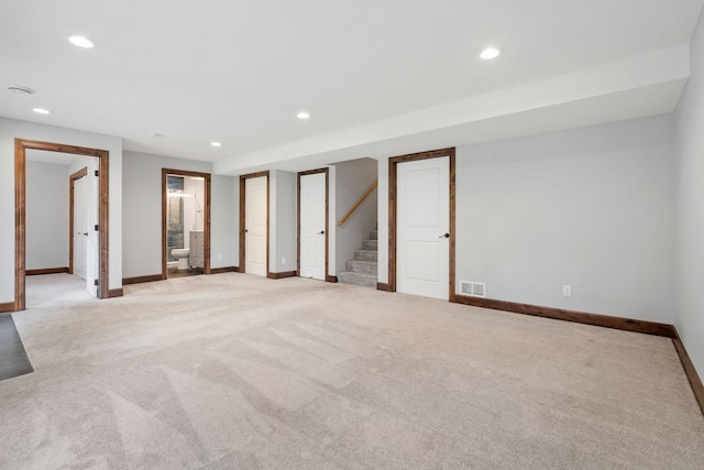 6701 Urbandale Ln N, Maple Grove, MN 55311 - unfurnished room featuring light colored carpet, recessed lighting, and stairs