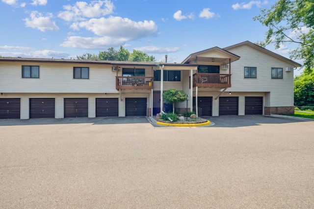 4004 Foss Rd Unit 101, Saint Anthony, MN 55421 - multi unit property with a garage, a balcony, and asphalt driveway