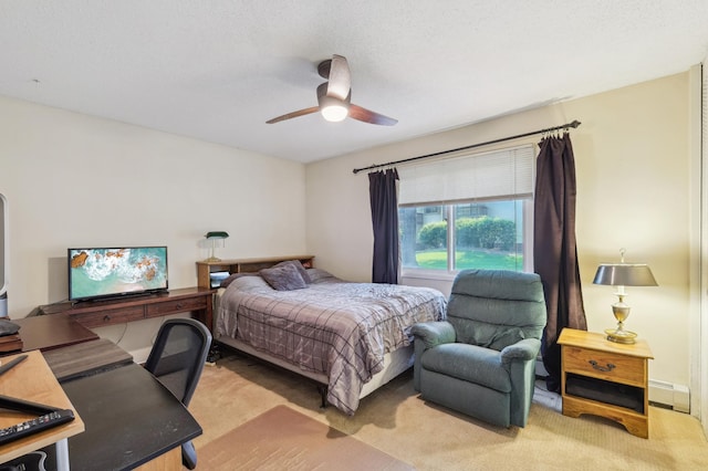 4004 Foss Rd Unit 101, Saint Anthony, MN 55421 - bedroom with light colored carpet, a desk, ceiling fan, and baseboard heating