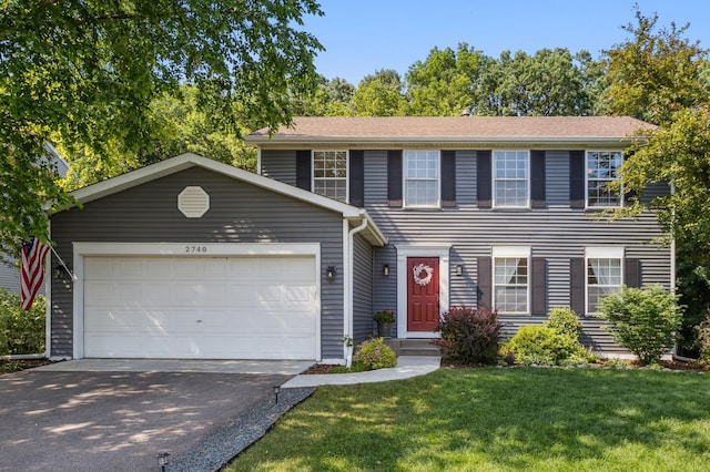 2740 Simons Dr, Chaska, MN 55318 - colonial-style house featuring driveway, a front yard, and an attached garage