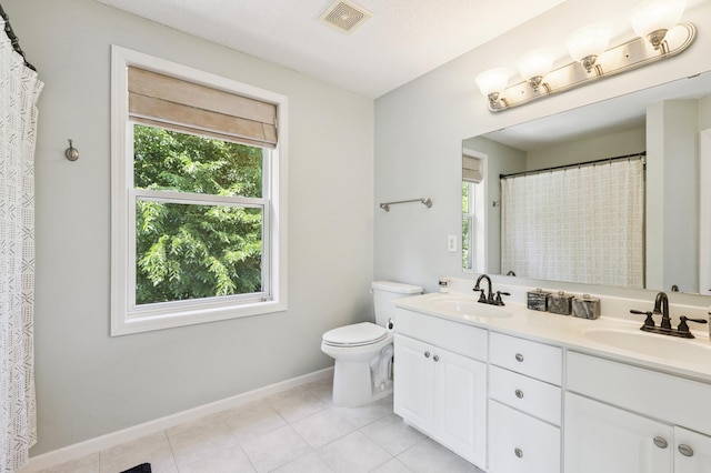 2740 Simons Dr, Chaska, MN 55318 - bathroom with plenty of natural light, double vanity, tile patterned flooring, and curtained shower