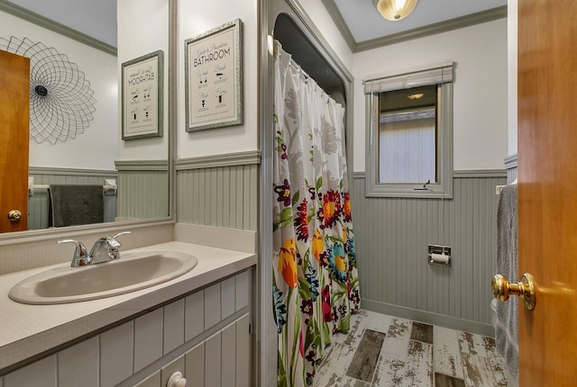 21014 Elmway Rd, Richmond, MN 56368 - bathroom with crown molding, vanity, a wainscoted wall, and curtained shower