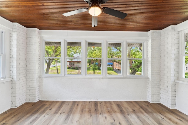 987 Dayton Ave, Saint Paul, MN 55104 - unfurnished sunroom featuring wood ceiling, brick wall, and wood finished floors