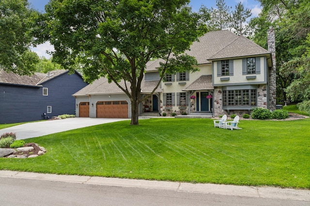 1561 Creek Run Trl, Chanhassen, MN 55331 - view of front of house with driveway, a chimney, an attached garage, and a front lawn