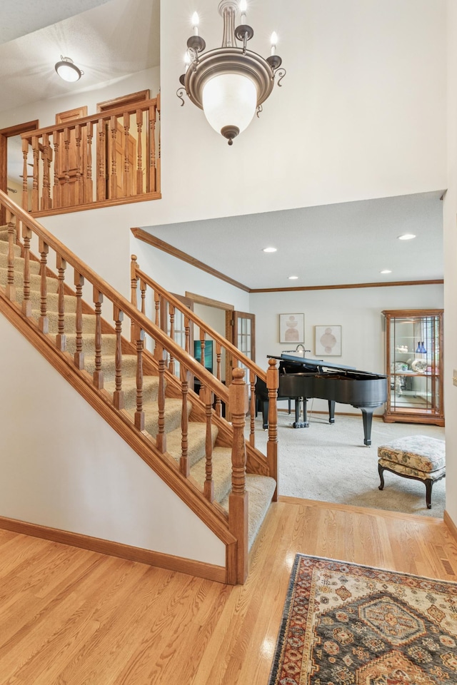 1561 Creek Run Trl, Chanhassen, MN 55331 - stairway with billiards, wood finished floors, crown molding, and recessed lighting