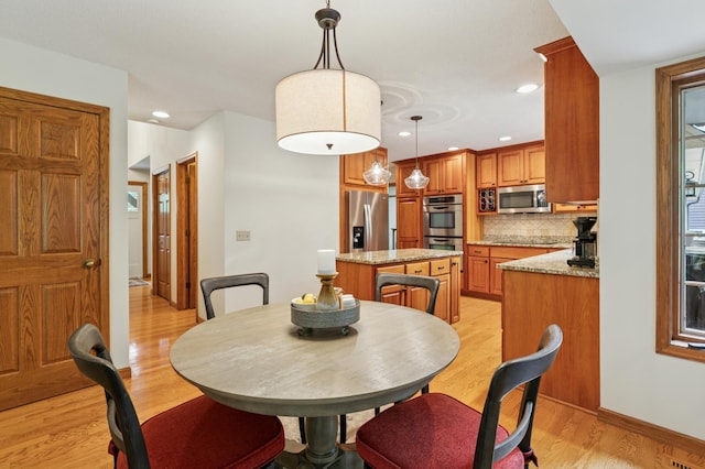 1561 Creek Run Trl, Chanhassen, MN 55331 - dining area featuring light wood-type flooring and recessed lighting