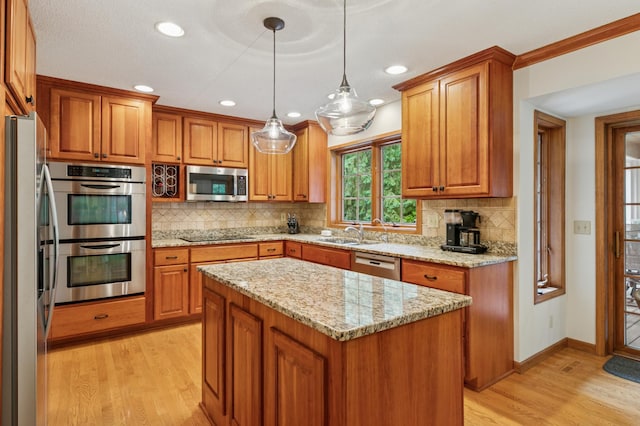1561 Creek Run Trl, Chanhassen, MN 55331 - kitchen with appliances with stainless steel finishes, light wood-style floors, brown cabinetry, and recessed lighting