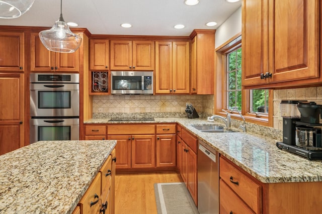 1561 Creek Run Trl, Chanhassen, MN 55331 - kitchen with stainless steel appliances, brown cabinets, and recessed lighting