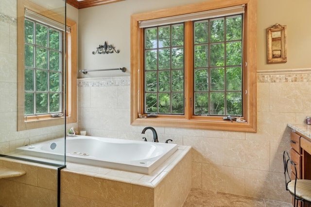 1561 Creek Run Trl, Chanhassen, MN 55331 - bathroom featuring tile walls, a bath, vanity, a wainscoted wall, and tile patterned flooring