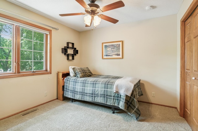 1561 Creek Run Trl, Chanhassen, MN 55331 - bedroom with carpet flooring, a closet, and a ceiling fan