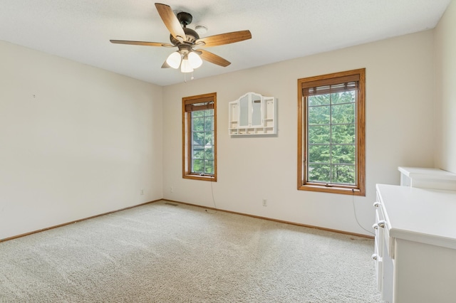 1561 Creek Run Trl, Chanhassen, MN 55331 - unfurnished room with light colored carpet, healthy amount of natural light, and ceiling fan