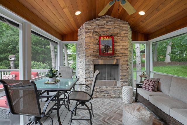 1561 Creek Run Trl, Chanhassen, MN 55331 - sunroom featuring vaulted ceiling, ceiling fan, an outdoor living space with a fireplace, and outdoor dining area