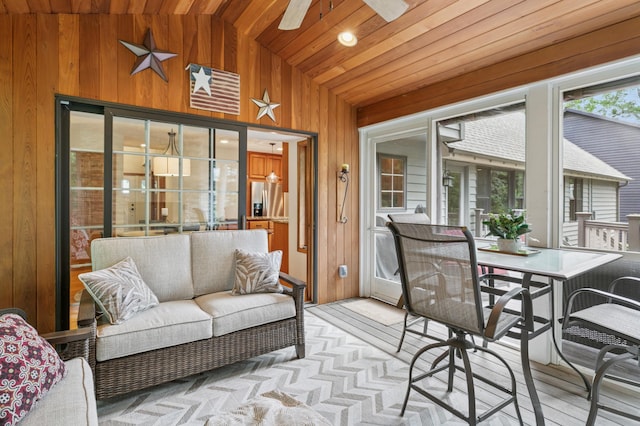 1561 Creek Run Trl, Chanhassen, MN 55331 - sunroom with lofted ceiling, a ceiling fan, outdoor lounge area, and outdoor dining space