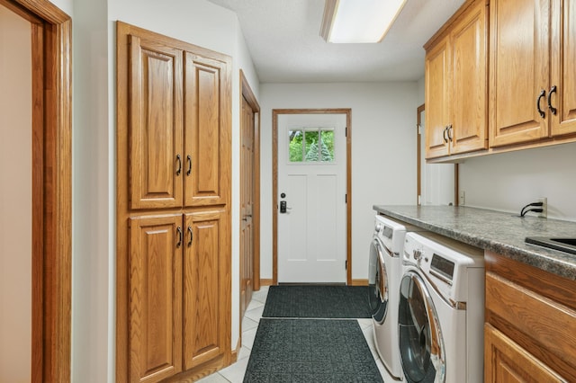 1561 Creek Run Trl, Chanhassen, MN 55331 - laundry room with cabinet space, washing machine and clothes dryer, and light tile patterned floors