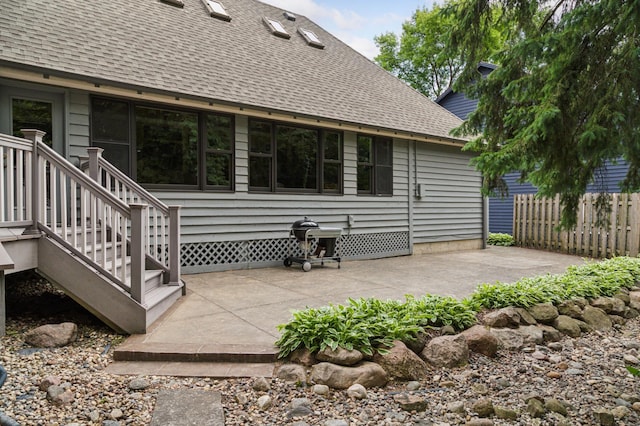 1561 Creek Run Trl, Chanhassen, MN 55331 - rear view of house with a shingled roof and a patio area