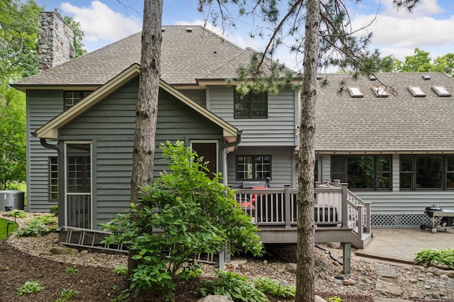 1561 Creek Run Trl, Chanhassen, MN 55331 - rear view of property with roof with shingles, a deck, a chimney, and a patio area
