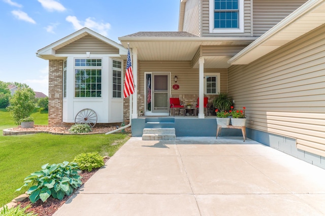 13589 Birch Rd, Rogers, MN 55374 - doorway to property featuring a lawn, brick siding, a shingled roof, and covered porch