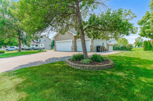 13589 Birch Rd, Rogers, MN 55374 - view of property hidden behind natural elements featuring asphalt driveway and a front yard